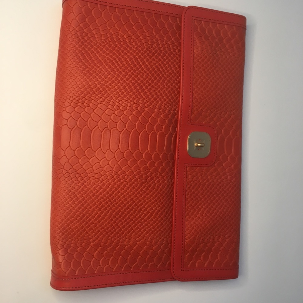 NWT.  Longchamp, oversized orange leather clutch